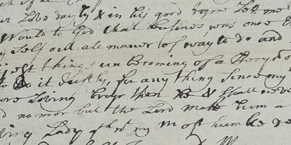 A clip from a letter written in the 18th Century in a looping italic hand, its content hard to read